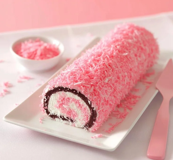 Delicious SnoBall Cake Roll with fluffy cream filling and a dusting of coconut.