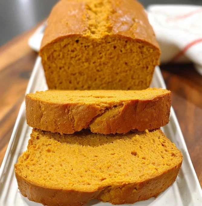 Slice of homemade sweet potato bread with a golden crust