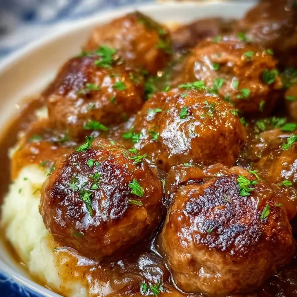 Slow cooker Salisbury Steak Meatballs served with gravy and mashed potatoes