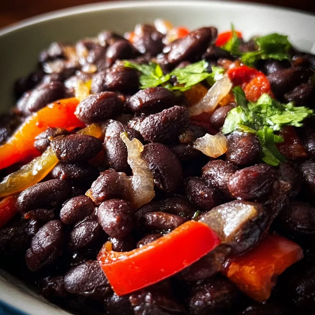 Slow cooker black beans with peppers and onions in a bowl