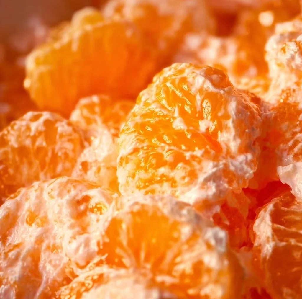 Mandarin Orange Jello Salad served in a bowl with fruit garnishes