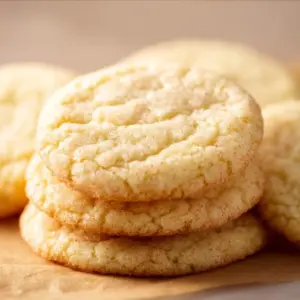Chewy sugar cookies on a plate with colorful sprinkles