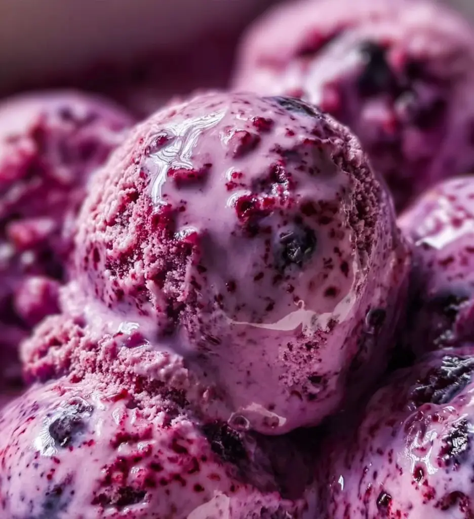 Blueberry cottage cheese ice cream served in a bowl with fresh blueberries