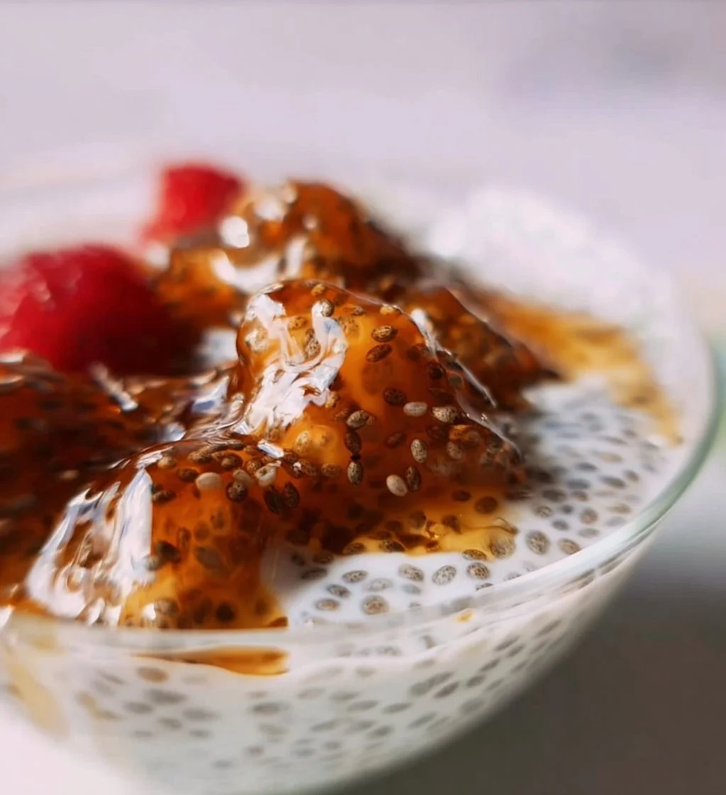 Chia seeds mixed in creamy yogurt topped with fresh fruits