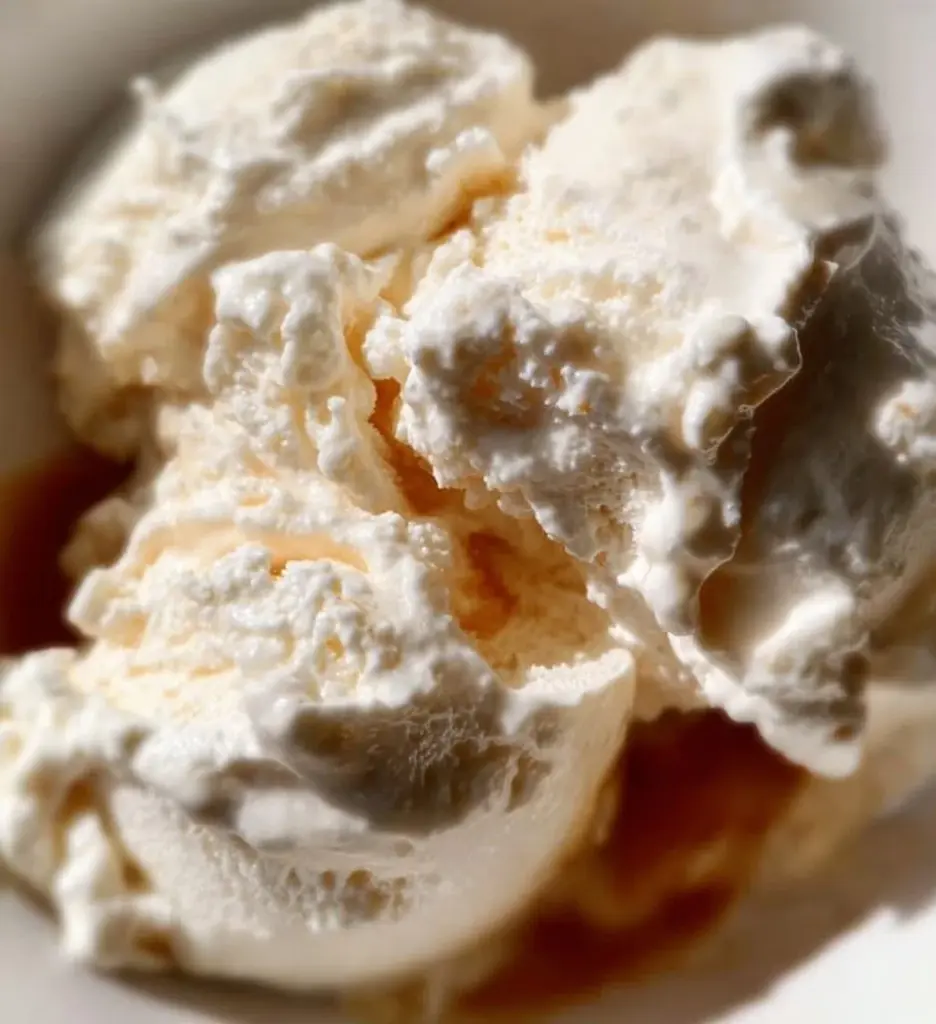 Creamy cottage cheese ice cream topped with brown butter and vanilla flavors